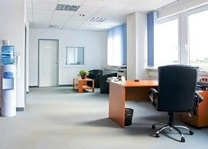Small and simple office space with interior carpeting
